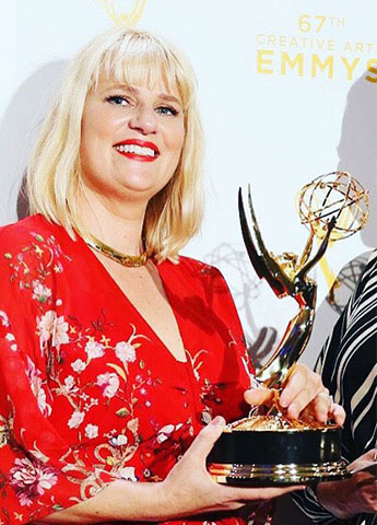 Marie Schley accepting an Emmy for her film costume designer work